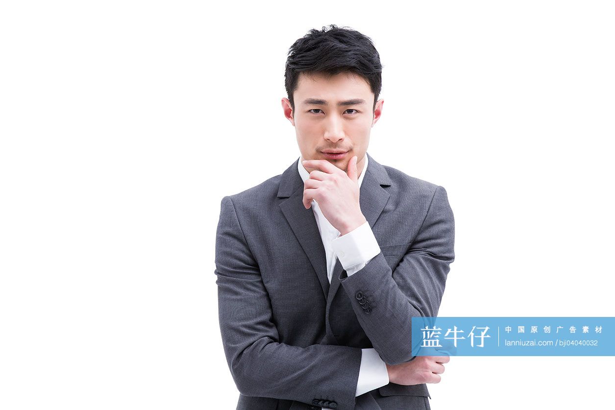 时尚的商务男士手托下巴思考