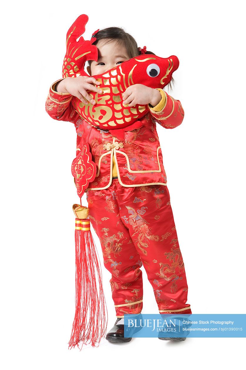 Young girl holding Chinese New Year fish