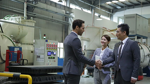 Business people shaking hands in factory,HD