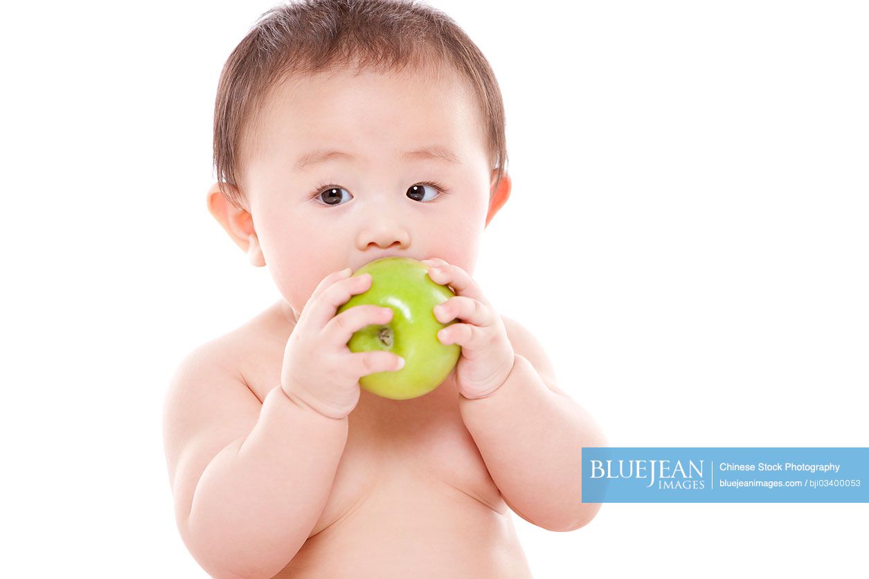 Cute Chinese baby girl and apple