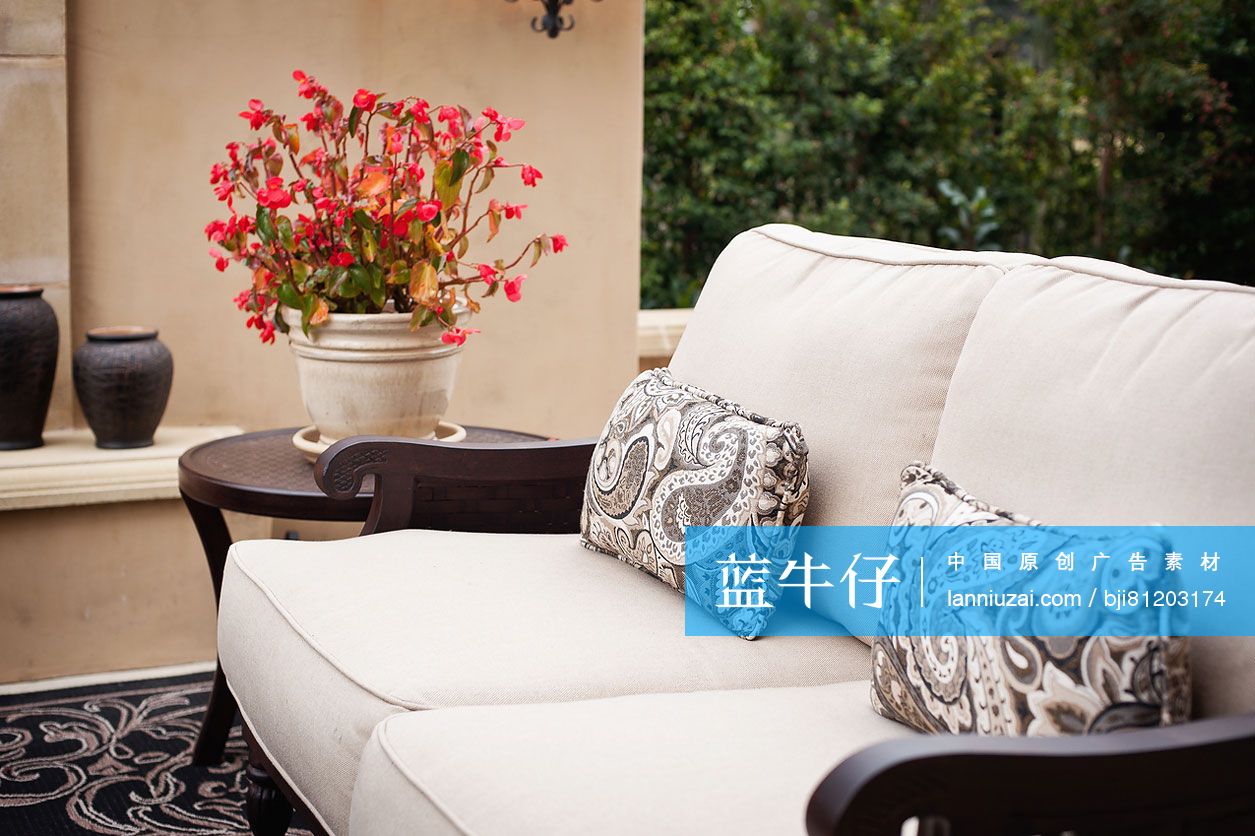 Couch with flower pot on end table at patio; Rancho Sante Fe; USA