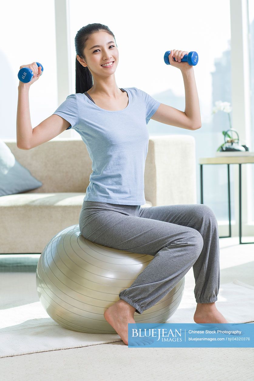 Woman exercise hand weights hi-res stock photography and images