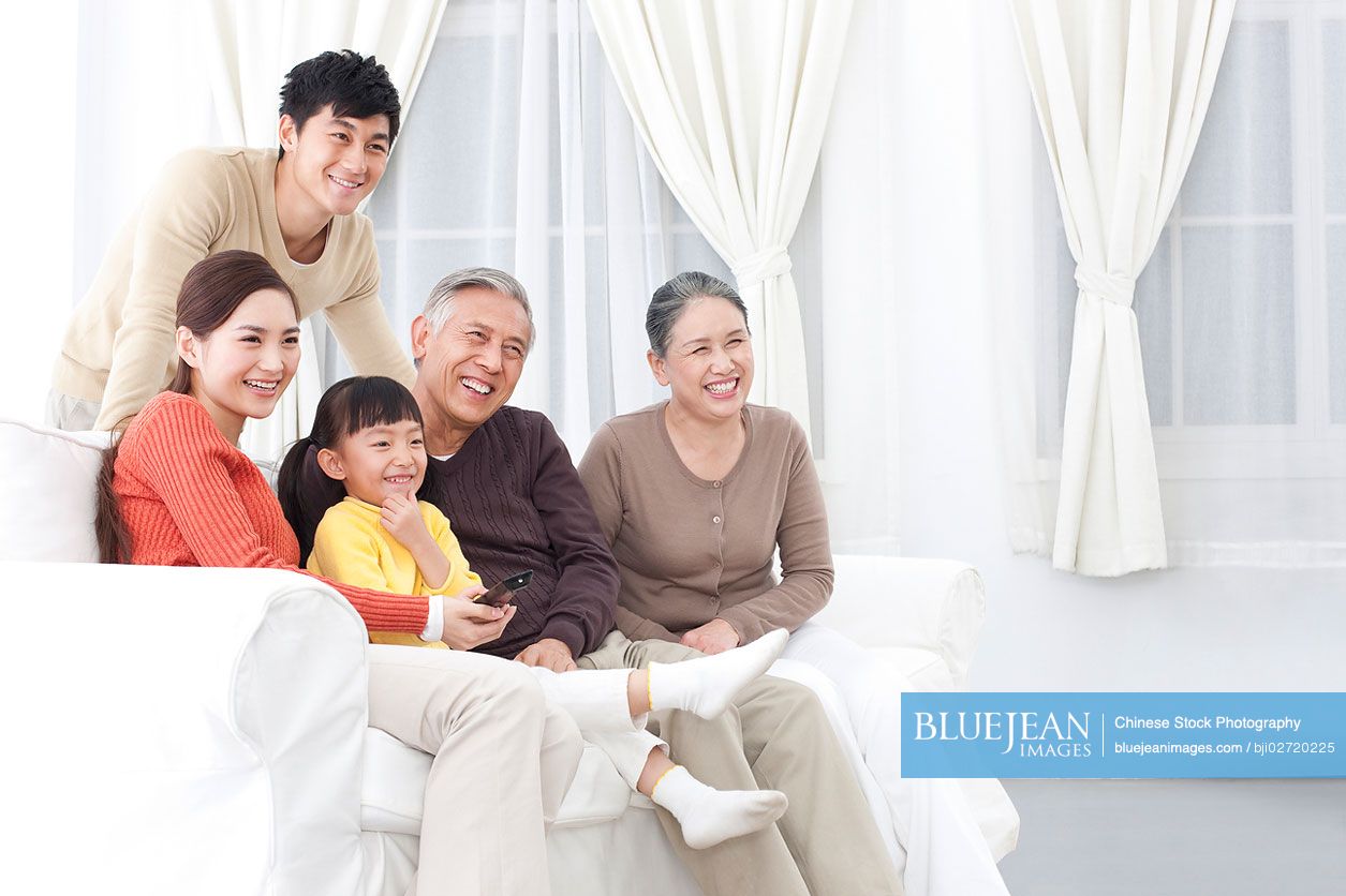 Chinese family watching TV together