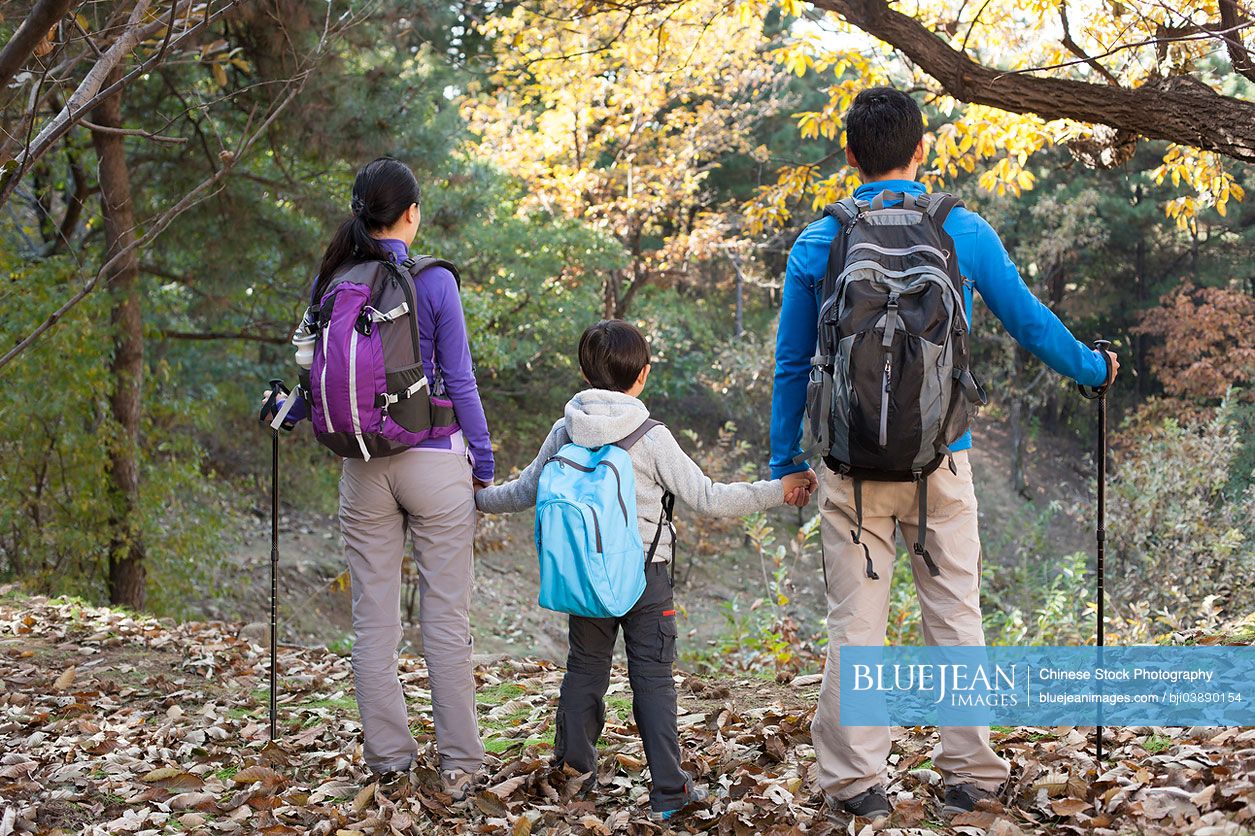 Young Chinese family on a hike