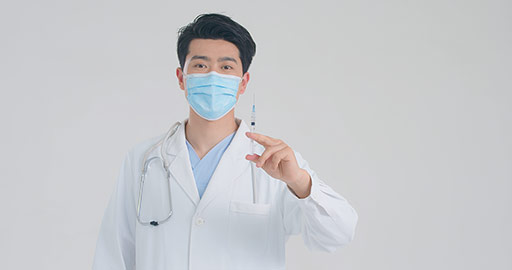 Young Chinese doctor holding syringe,4K