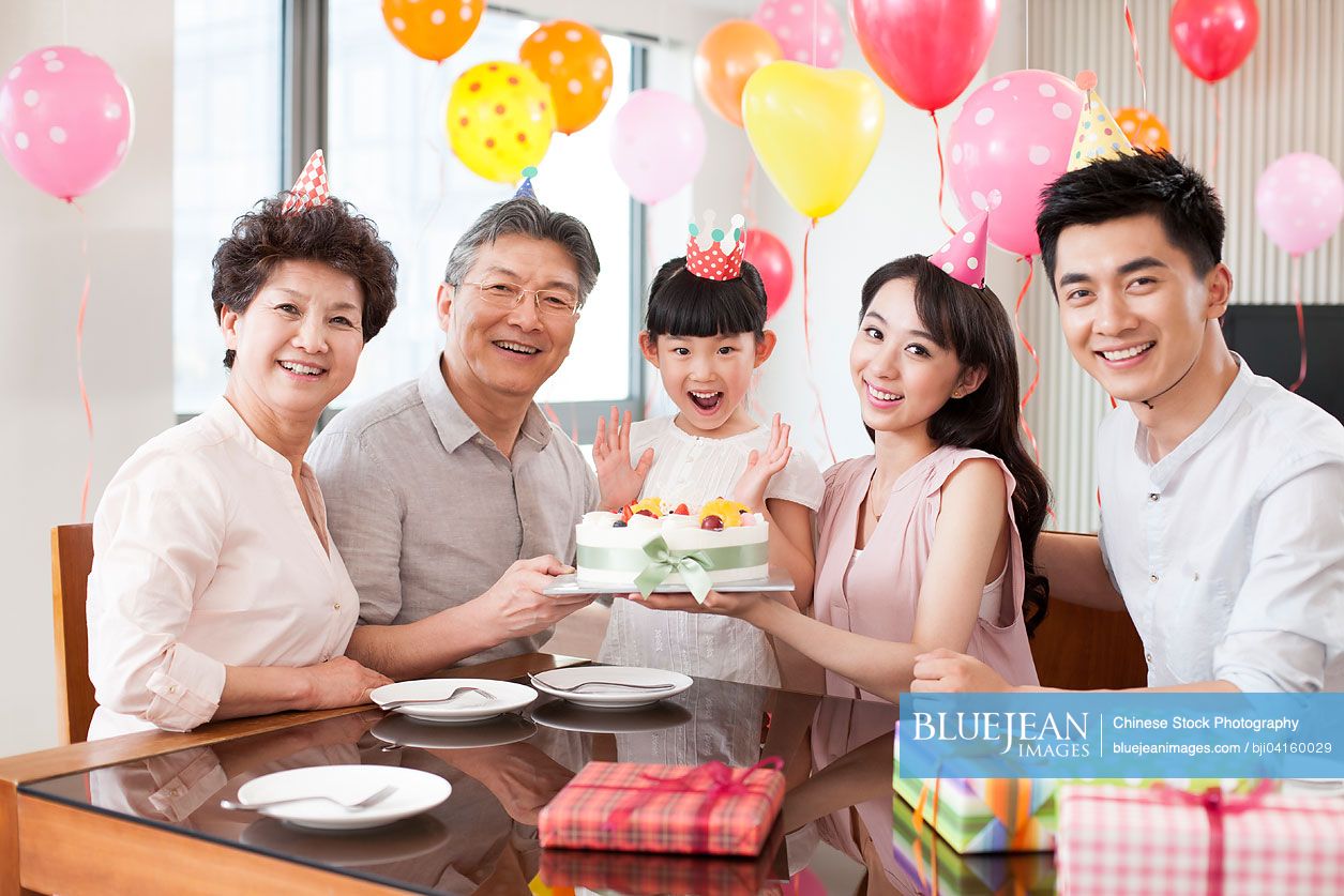 Happy Chinese family celebrating birthday