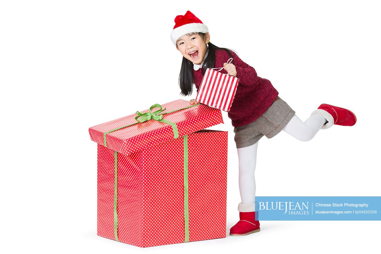 Happy Chinese girl with Christmas gifts