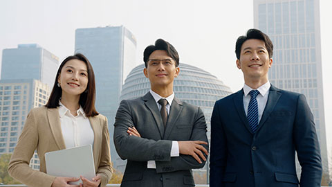 Confident Chinese business people looking at view