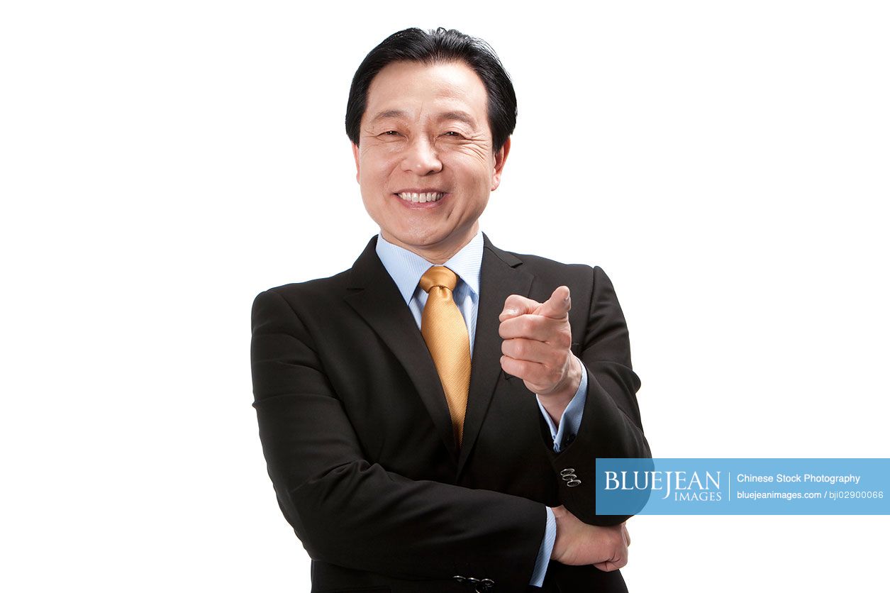 Senior Chinese businessman pointing the front