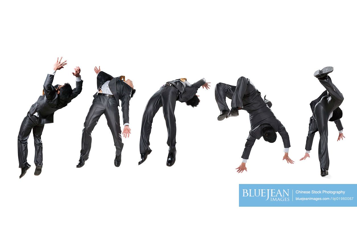 Five Chinese businessmen flipping in the air