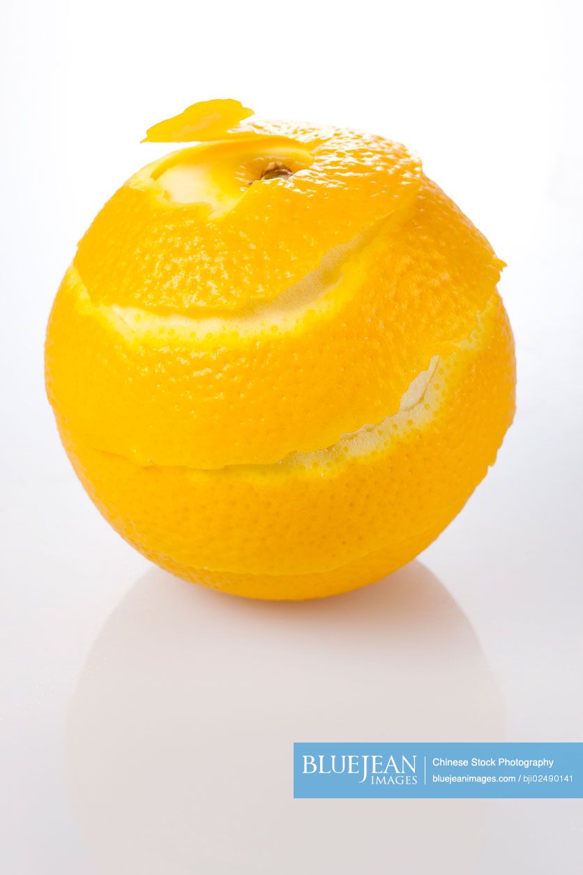 Peeled Orange on White Background