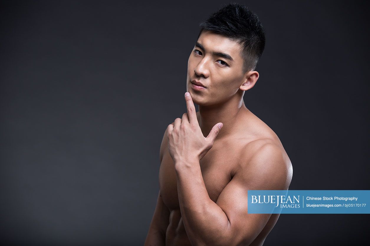 Portrait of young Chinese muscular man