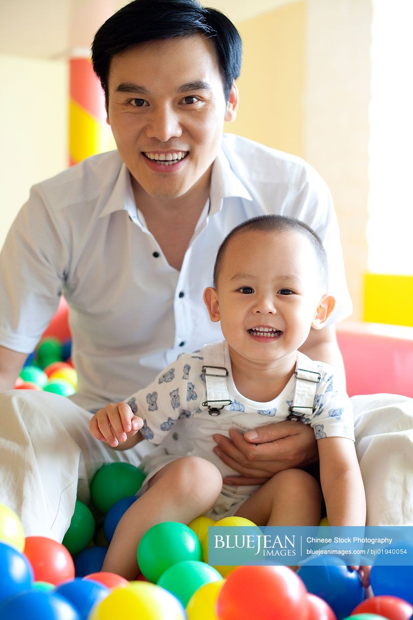 Chinese father playing with son