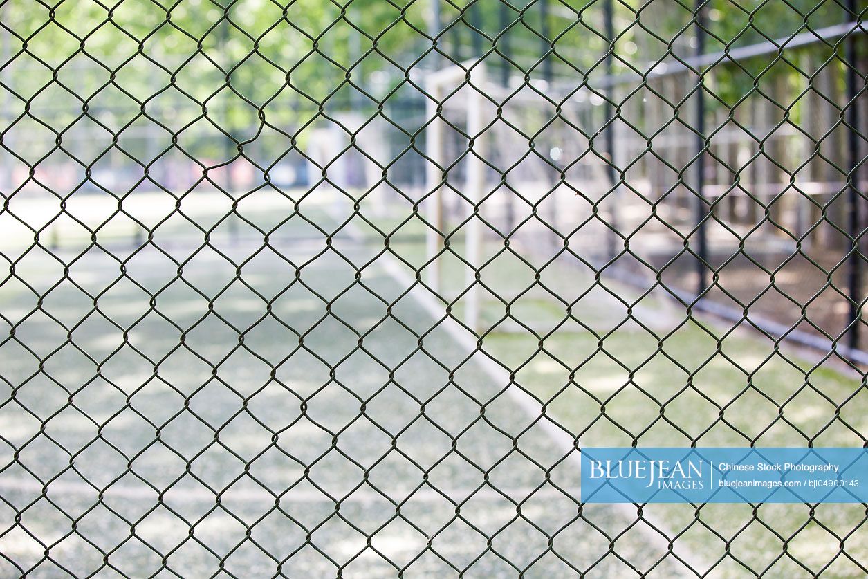 Soccer field behind fence