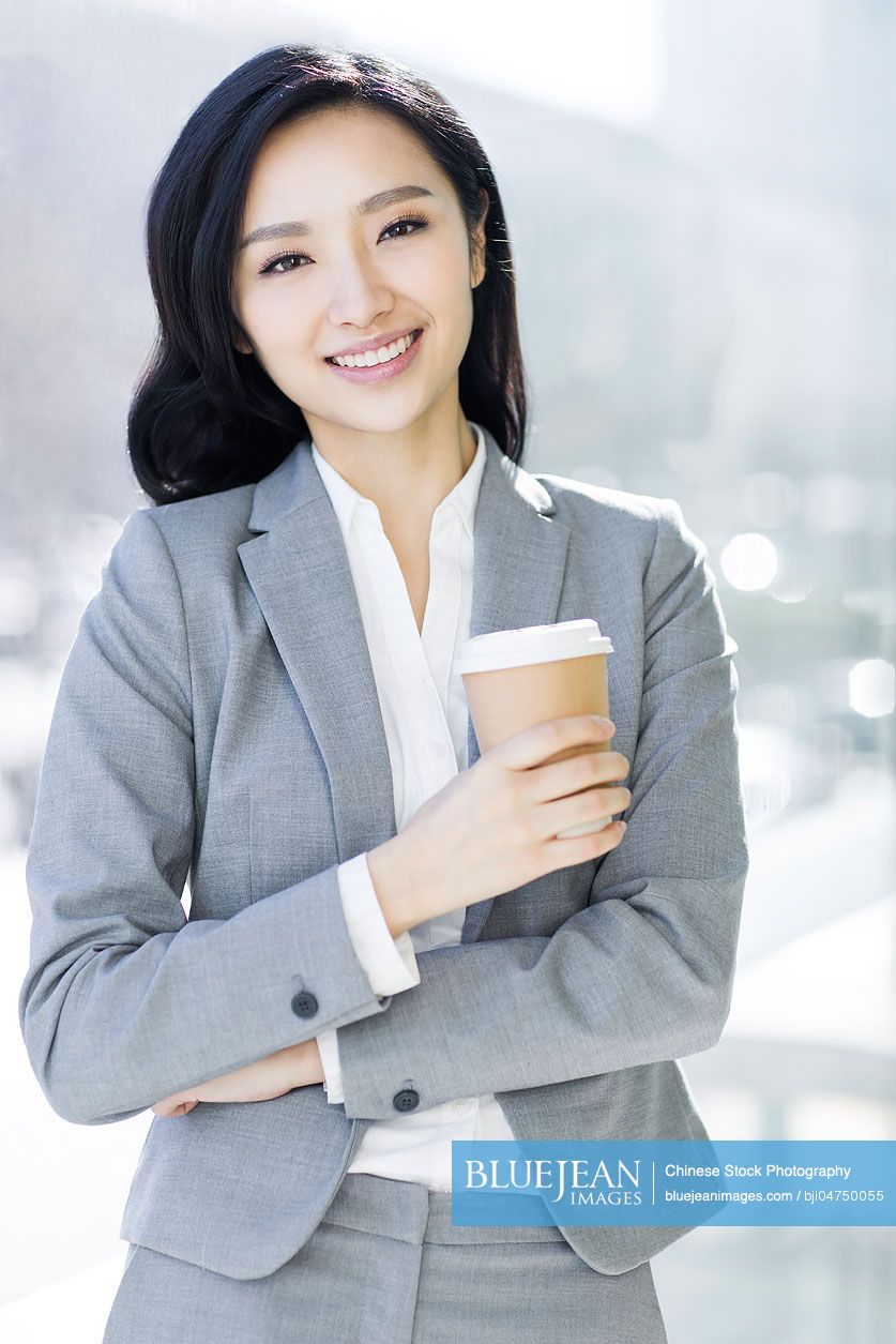 Chinese businesswoman taking a coffee break