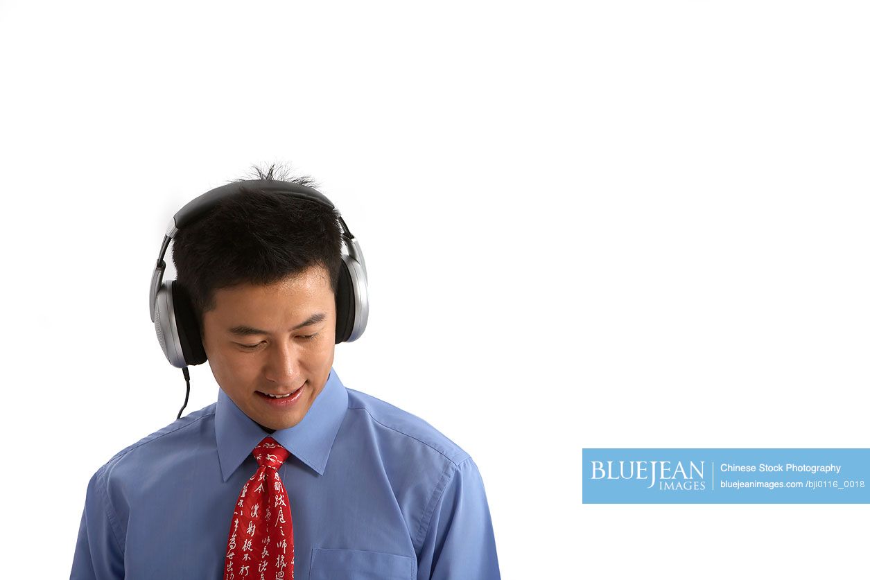 Chinese man listening to music