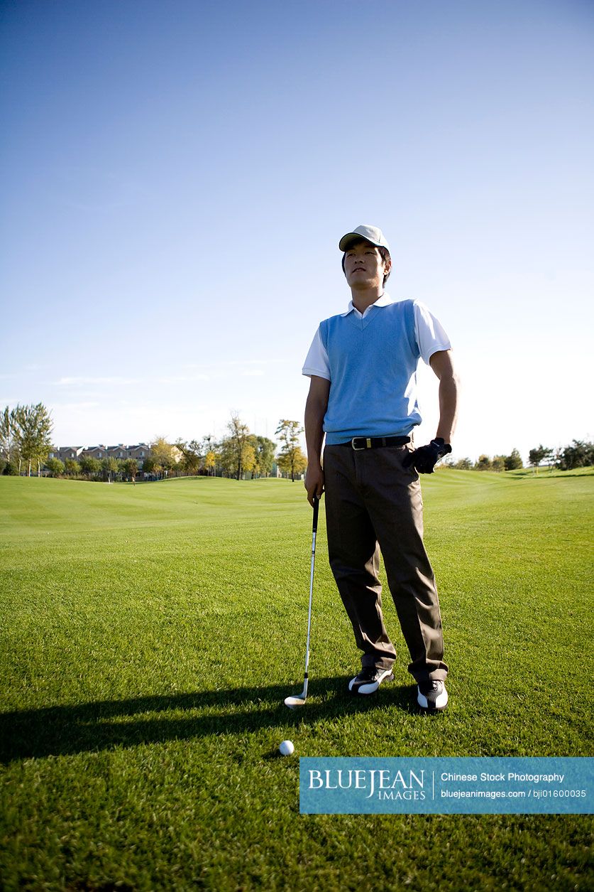 Chinese Golfer Standing On The Golf Course High res Stock Photo For Chinese golfer standing on the golf course high res stock photo for
