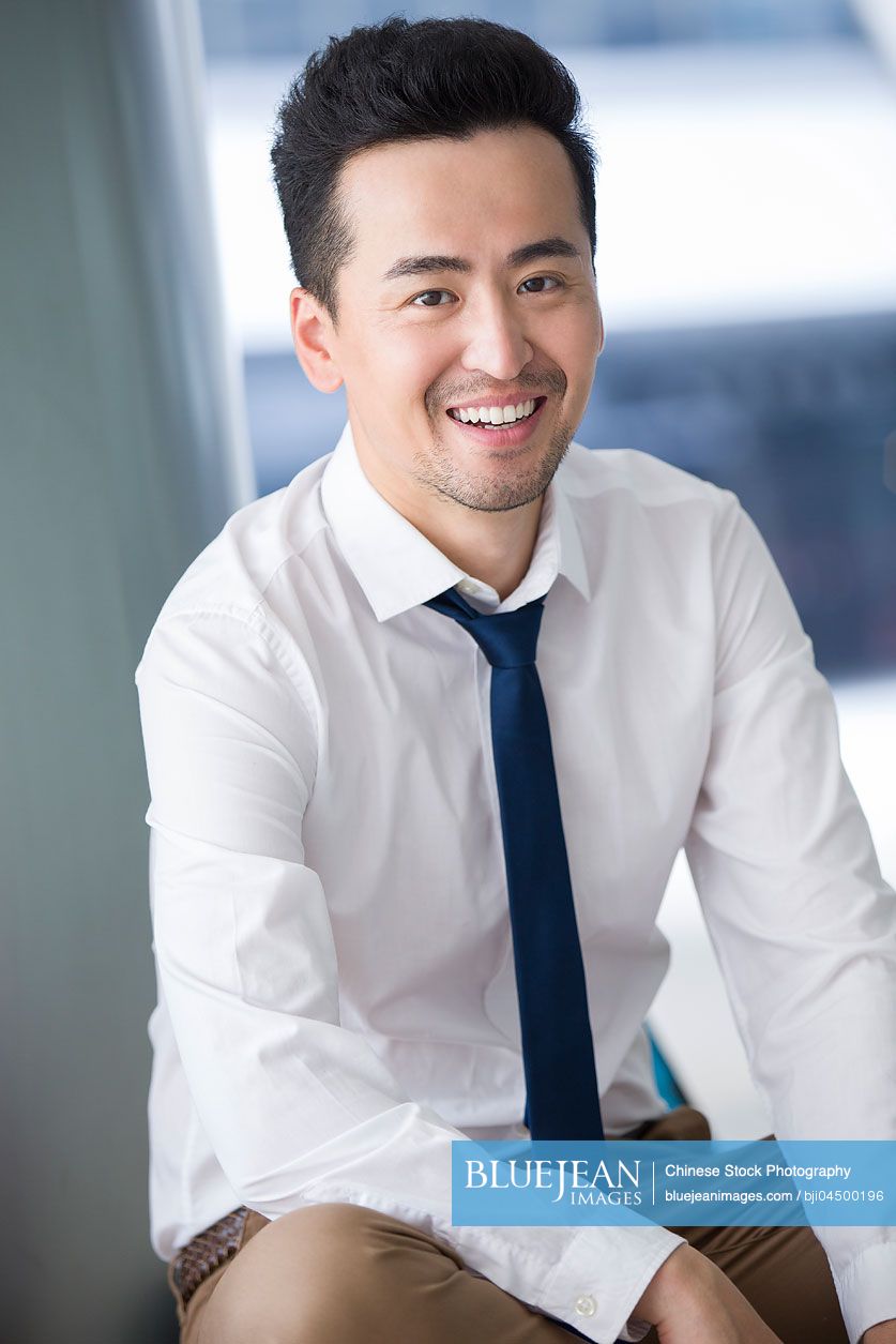 Portrait of happy Chinese businessman