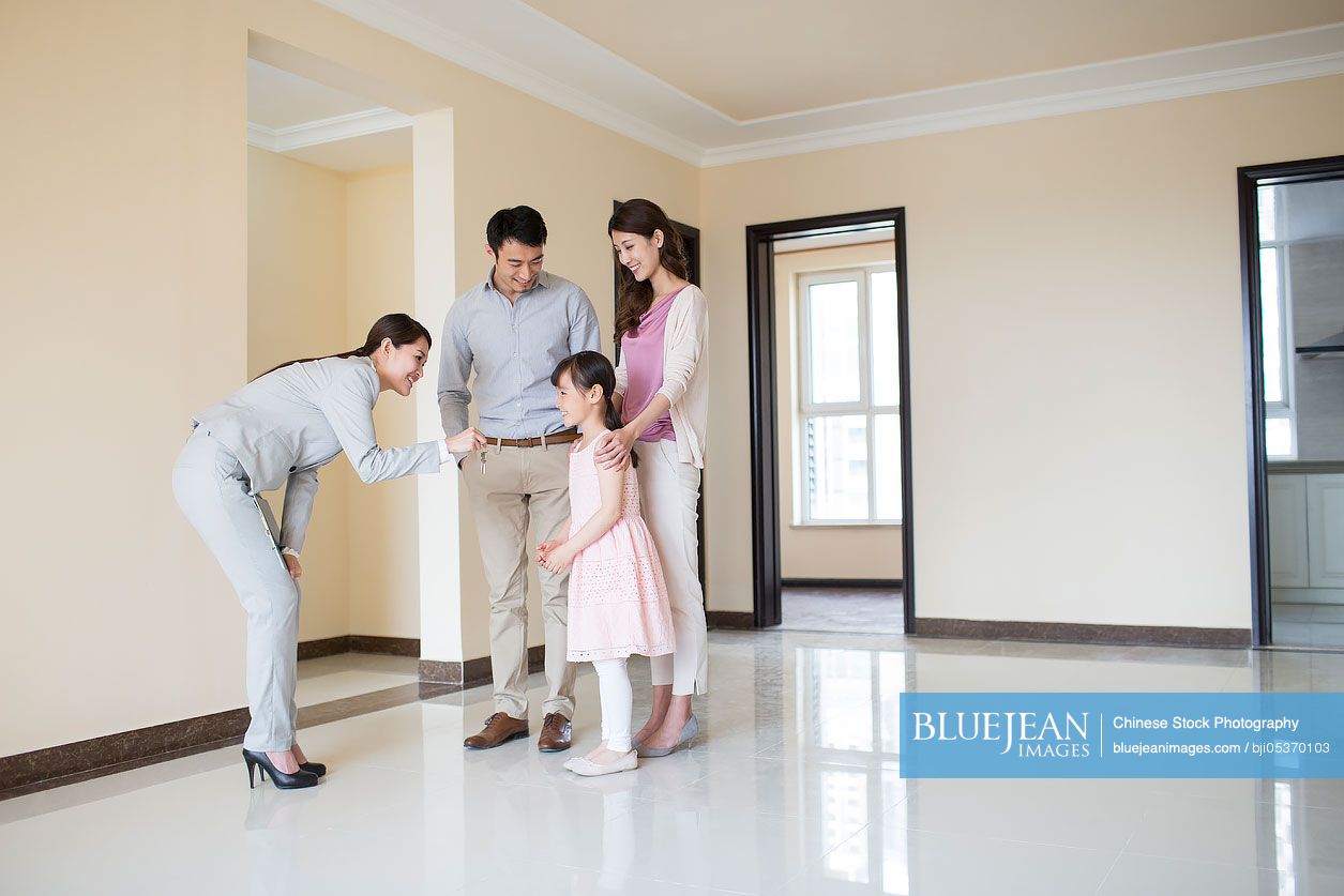 Chinese realtor giving young family keys to new house-High-res stock ...