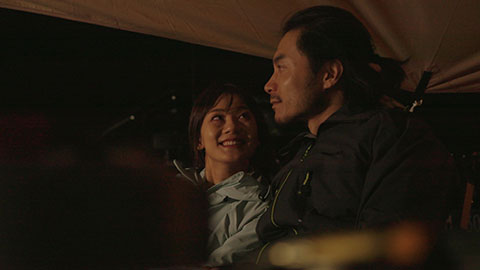 Happy Chinese couple camping outdoors,4K