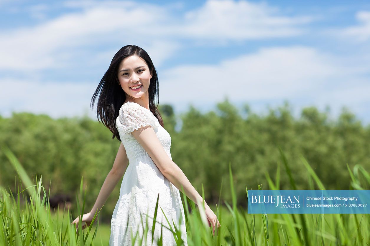 Young Chinese woman in grass area