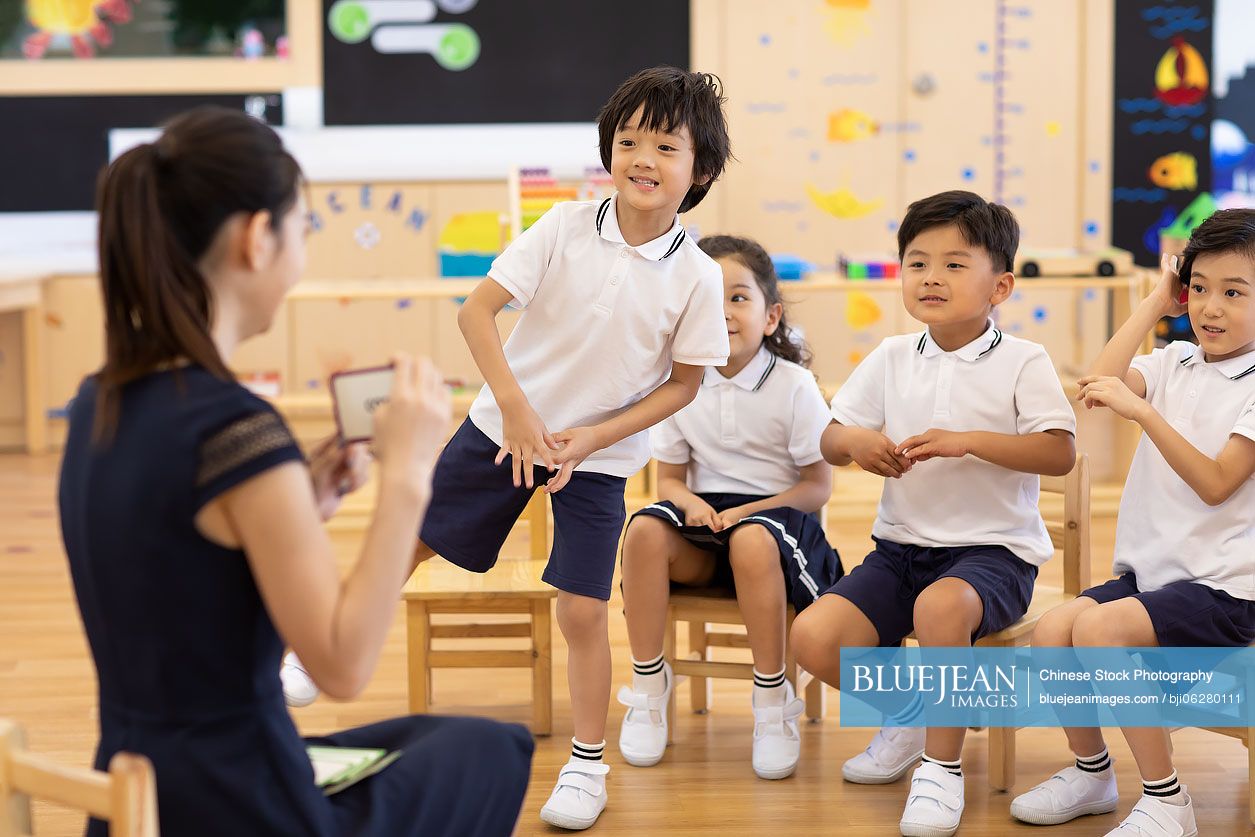 Chinese teacher and children in classroom