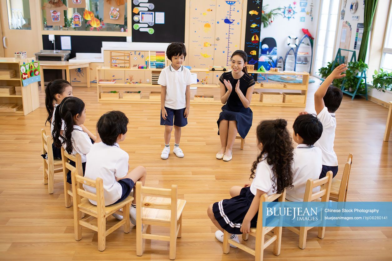 Chinese teacher and children in classroom