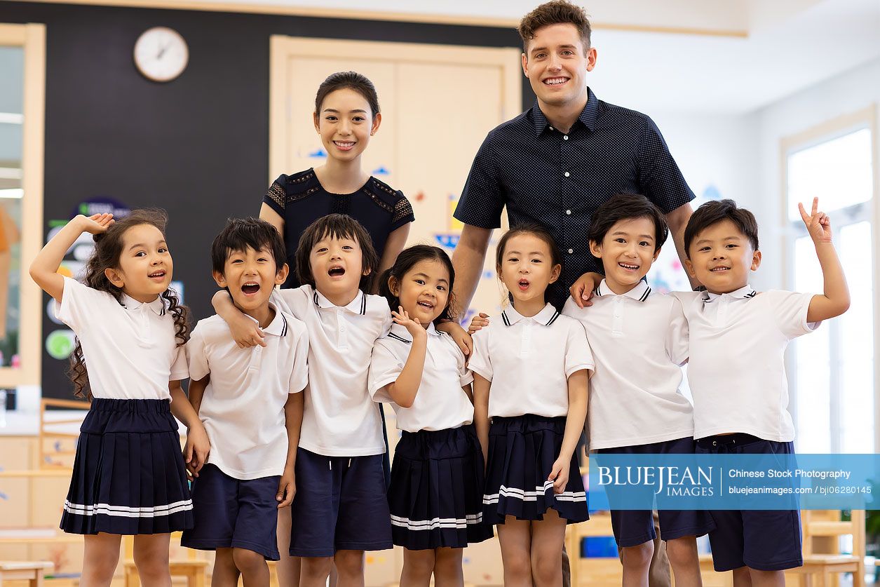 Teachers and children in classroom