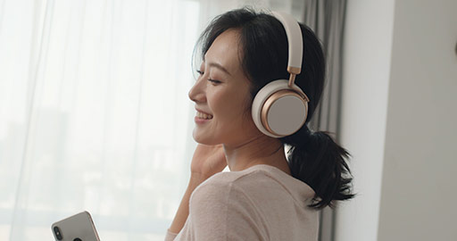Happy young Chinese woman listening to music,4K