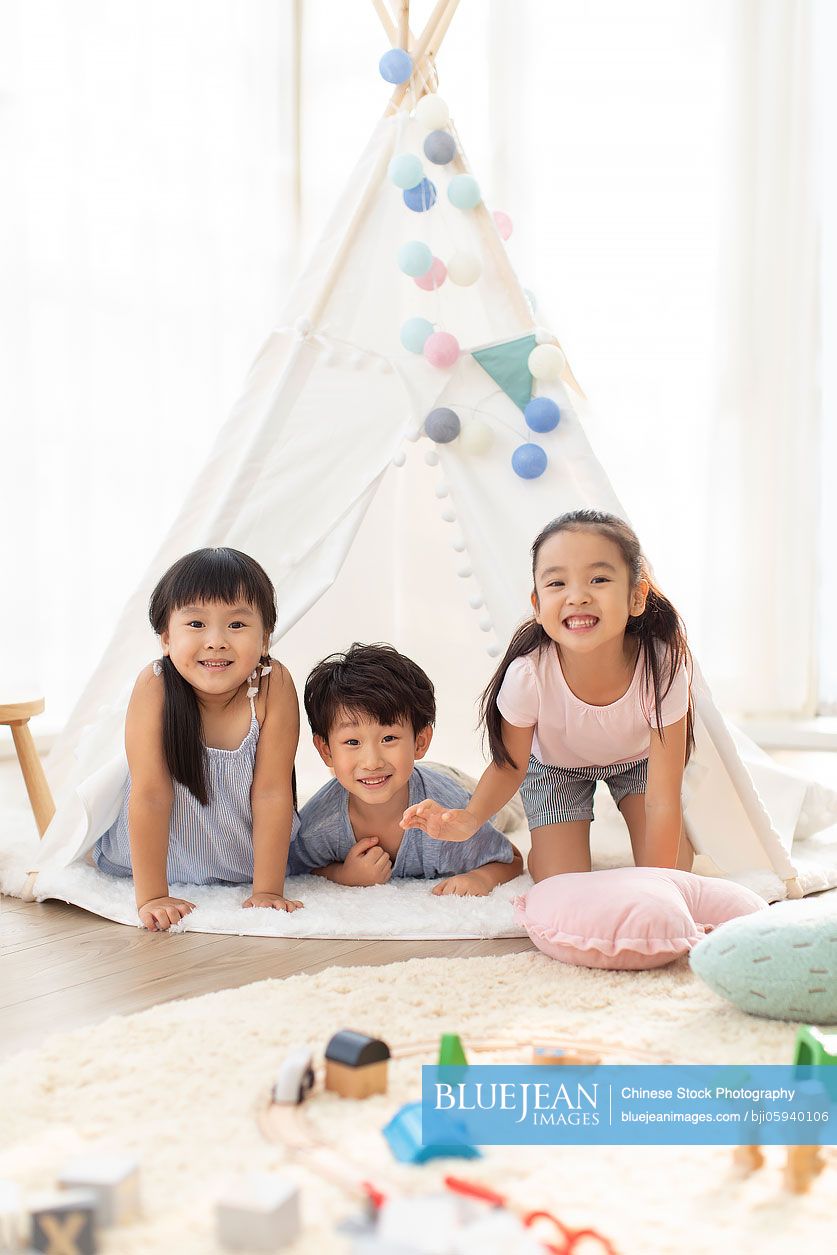 Cute Chinese children playing in tent
