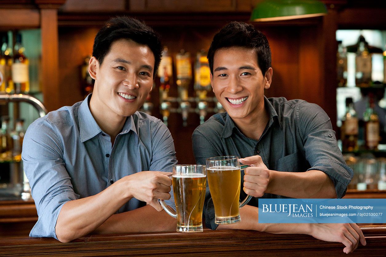 Chinese friends relaxing at a bar