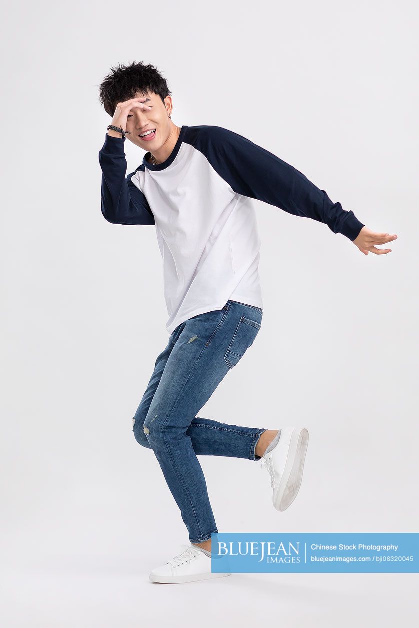 Cool young Chinese man dancing