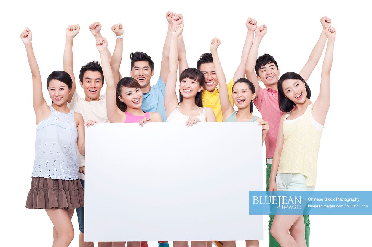 Group of young Chinese holding a whiteboard