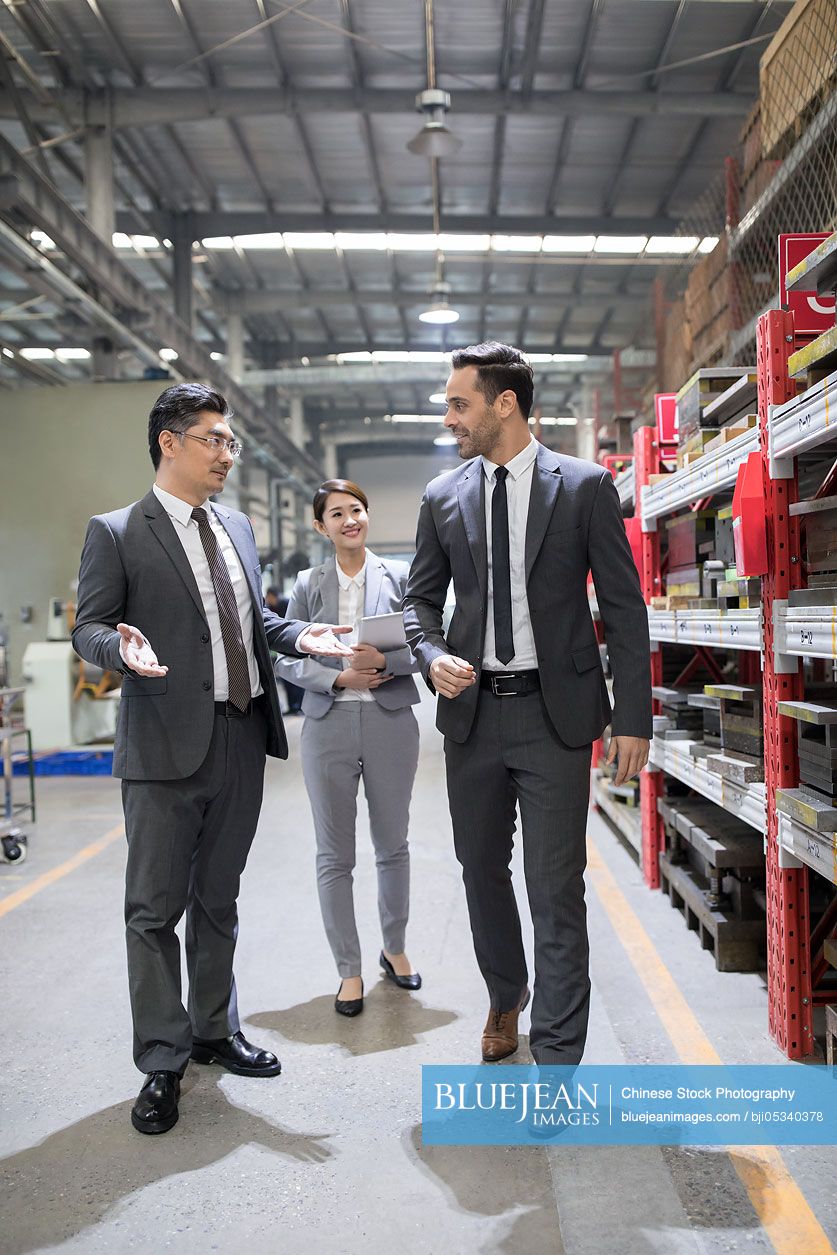 Business people talking in the factory