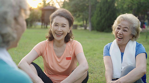 Happy senior Chinese friends relaxing in park,4K