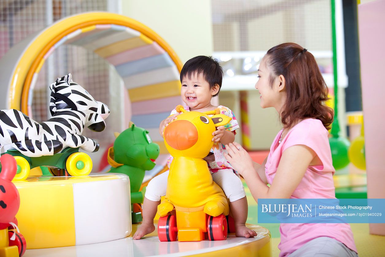 Chinese mother playing with daughter