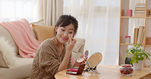 Young Chinese woman applying makeup at home,4K