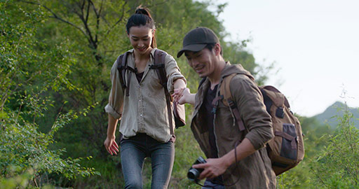 Young Chinese couple hiking outdoors,4K