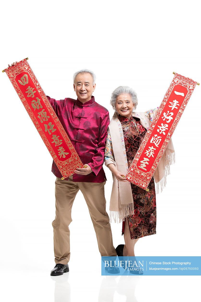 Happy senior Chinese couple celebrating Chinese new year