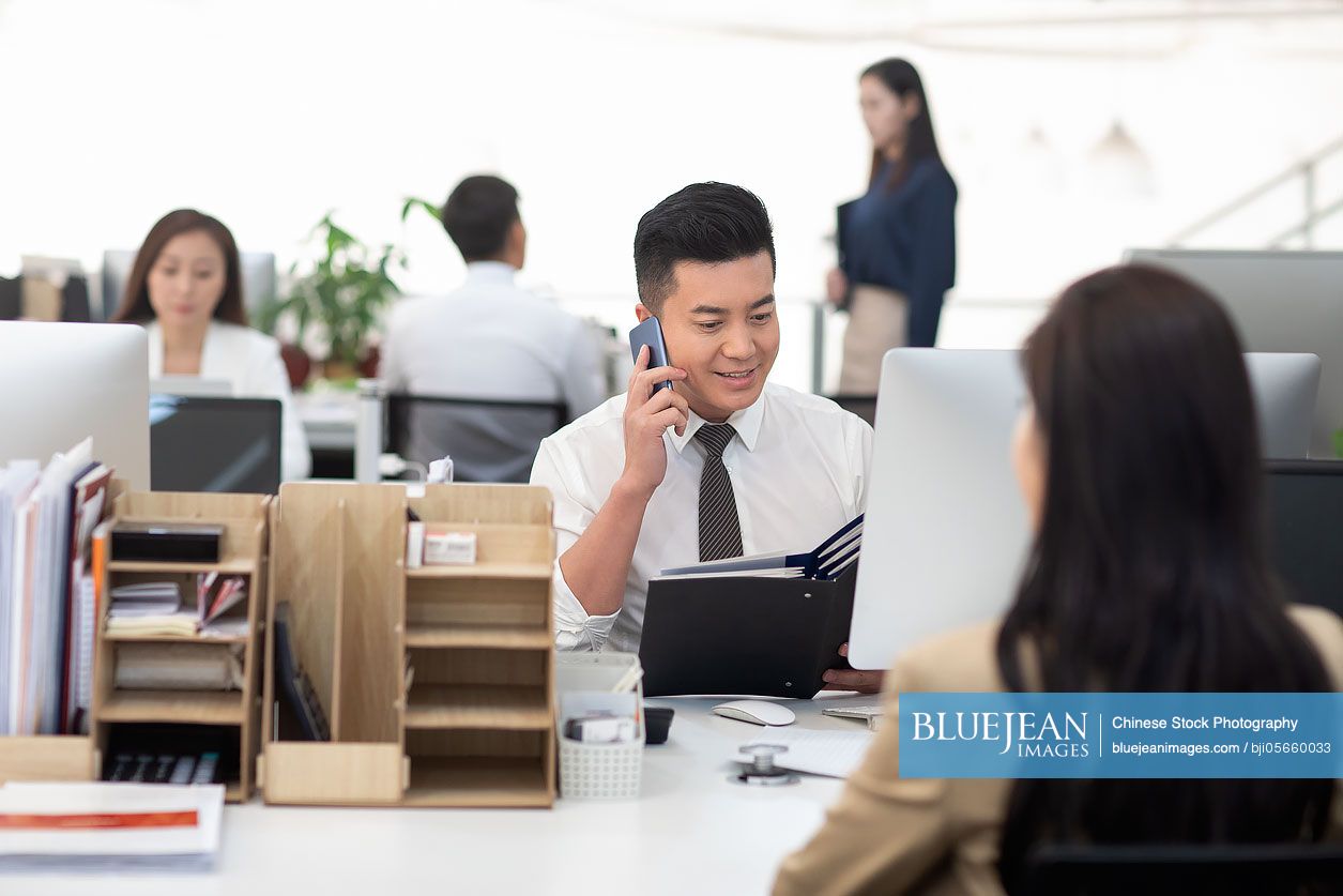 Chinese business people working in office