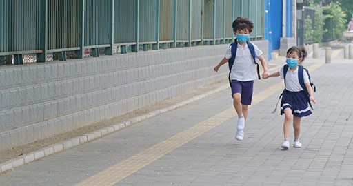 Two Chinese pupils wearing surgical masks to go to school,4K