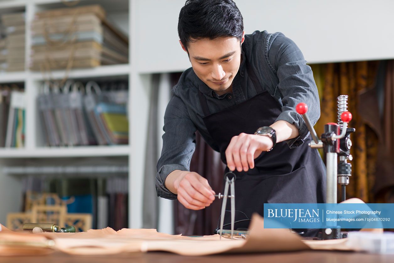 Chinese craftsman working in his studio