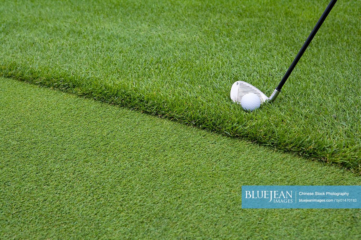 Close-up of chipping golf ball