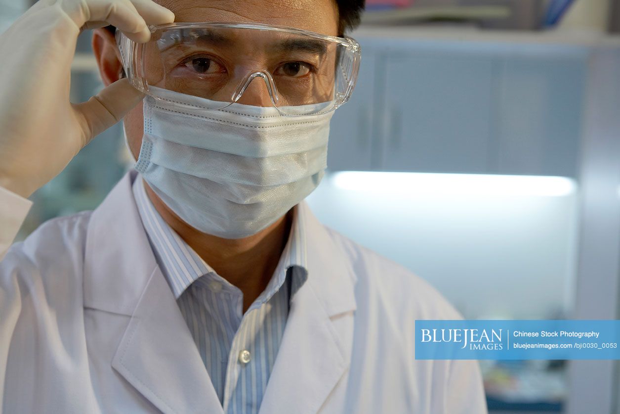 Chinese dentist wearing safety glasses