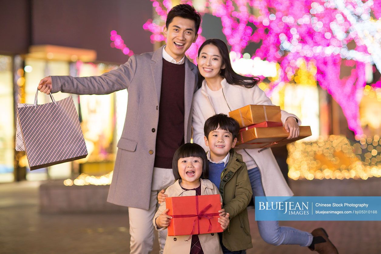 Cheerful young family shopping for Chinese new year