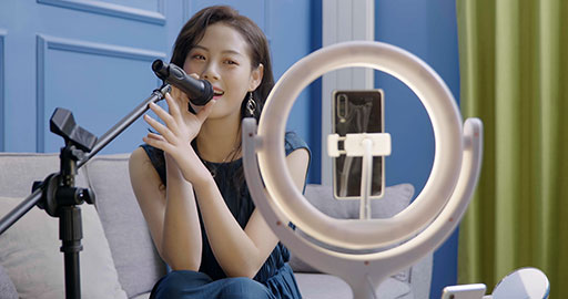 Female influencer live-streaming a product sale
