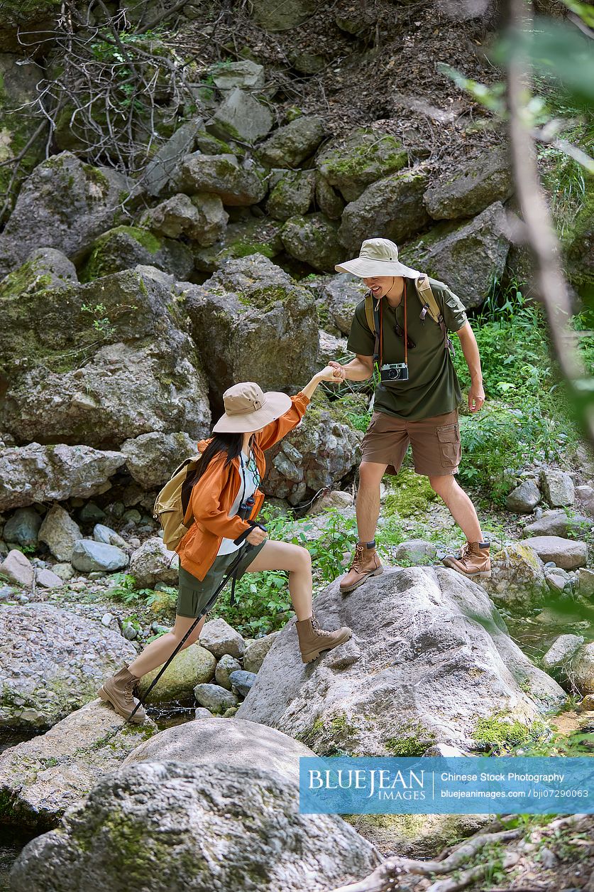 Happy couple hiking through the serene beauty of nature