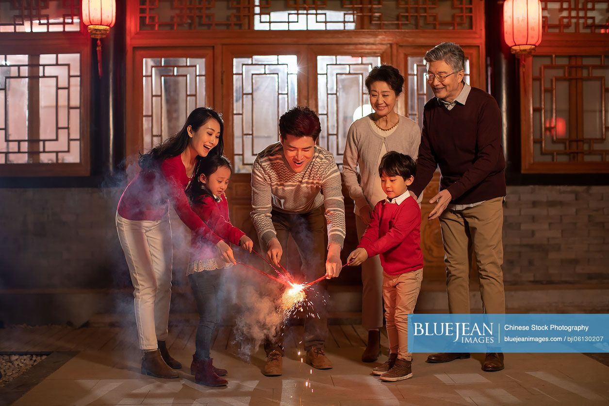 Happy Chinese family celebrating Chinese New Year