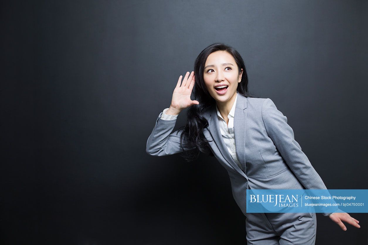 Chinese Businesswoman Eavesdropping High Res Stock Photo For Download