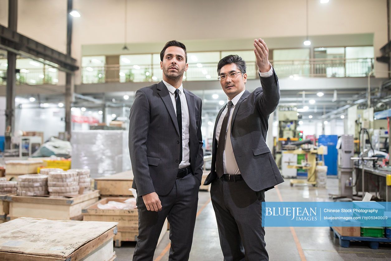 Business people talking in the factory